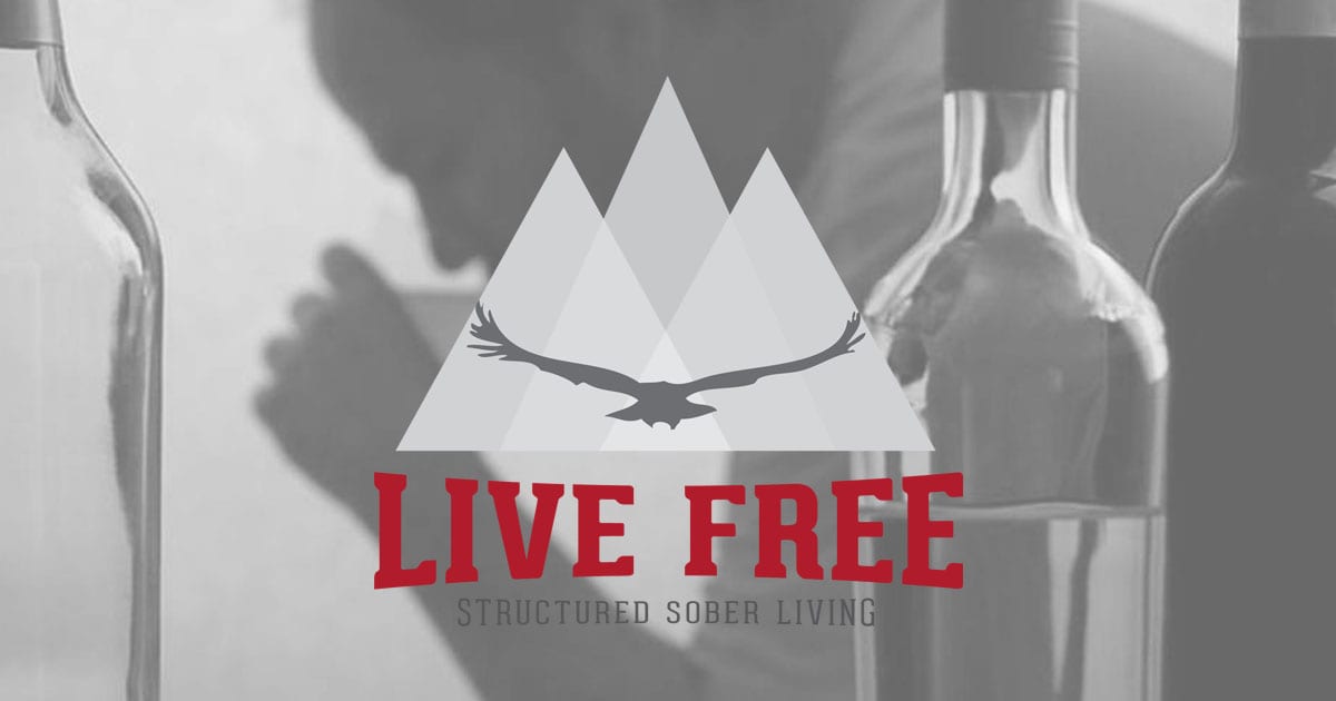 Live Free Logo with bottles in the background and a man drinking