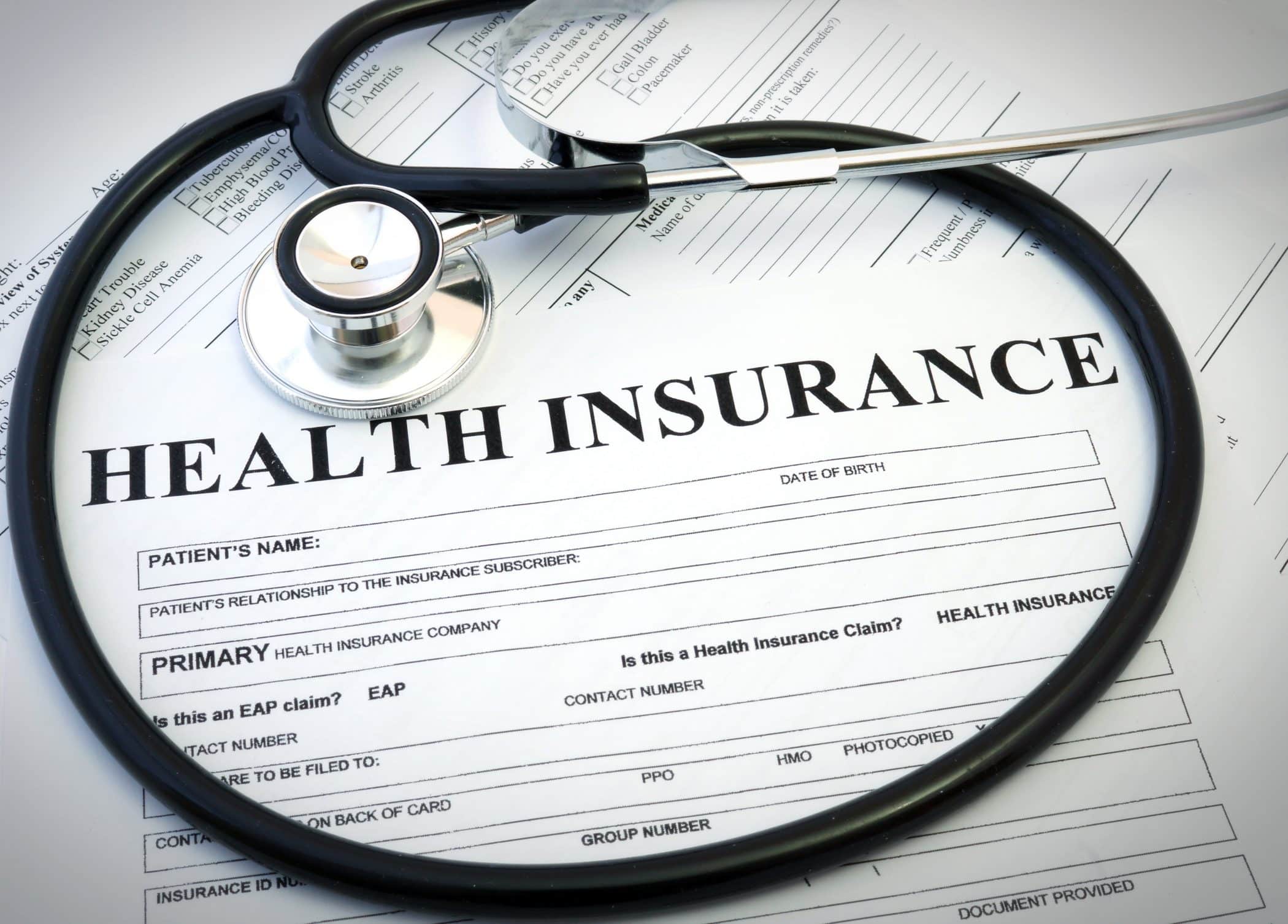 Health insurance form with stethoscope